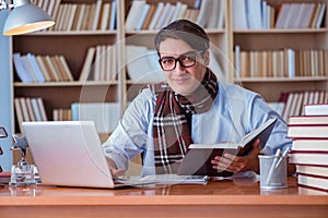 The young book writer writing in library