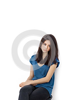 Young bored upset woman sitting on chair