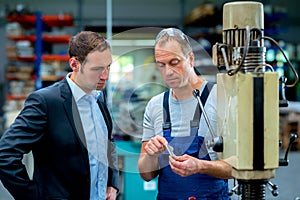 Young boss and worker in conversation