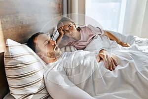 Sleeping snoring man lying in bed