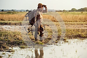 Bow hunter tracking prey. Modern Bow Hunter.