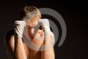 Young boxer in the defensive position