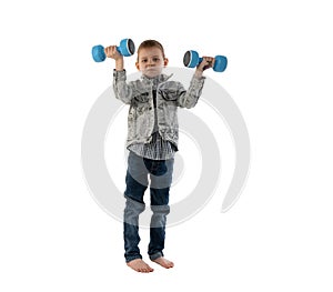 Young boy 6-9 years old with dumbbells isolated on white background. Physical education concept for a child