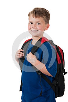 Young boy with backpack on white