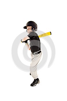 Young boy baseball player swinging at pitch with his eyes closed