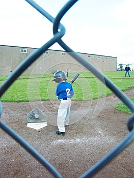 Young boy batting at T-ball.