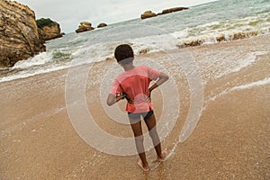 Young boy on beach, Biarritz, France