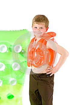 Young boy with beach mattress