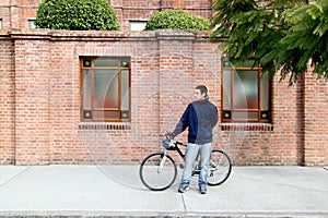 Young boy and bike in the city