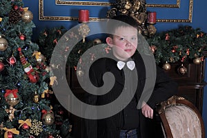 Young boy with a bow tie at the neck