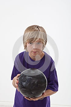 Young boy bowling