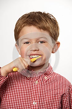 Young boy brushing teeth
