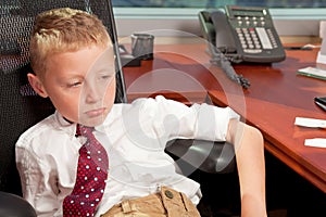 Young Boy in Business Office