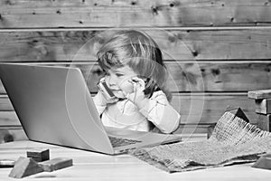 Young boy businessman. Small boy with computer and phone