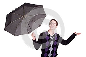 Young boy bypassing the umbrella, open arms