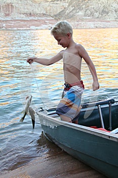 Young Boy Catches a Fish