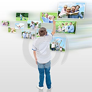 Young boy choosing his outdoor photo to share