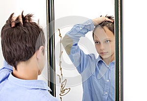 Young Boy Combing His Hair in Mirror