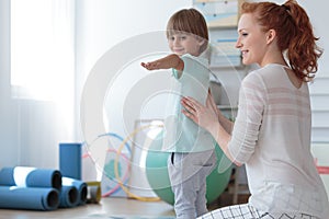 Young boy during corrective gymnastics