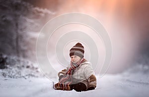 Young boy on country road in winter