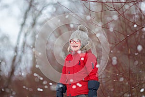 Young boy in countryside smiles in winer snow day