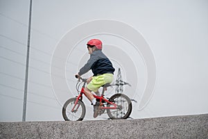 Young boy cycling pump track