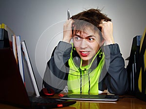 Young boy designer is angry