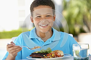 Young Boy Dining Al Fresco