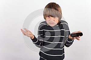 Young boy disappointed because he has a basic mobile phone only