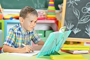 Young boy doing homework