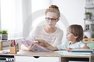 Young boy doing homework photo