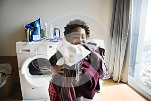 Young boy doing housework at home