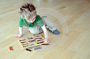 Young boy doing puzzle