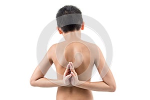 Young boy doing yoga exercise in Virasana