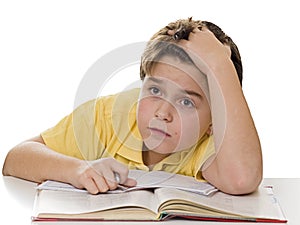 Young boy dreaming at homework