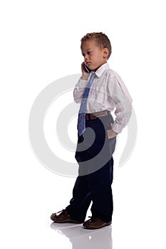 Young boy dressed as businessman with mobile phone