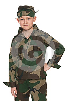 Young boy dressed in camouflage