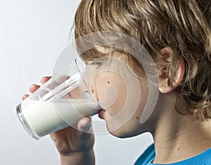 Young boy drinking milk