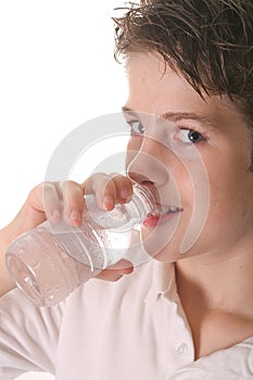 Young boy drinking water vertical upclose