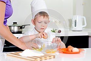 Young boy earning to be a chef