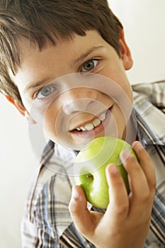 Young Boy Eating Apple