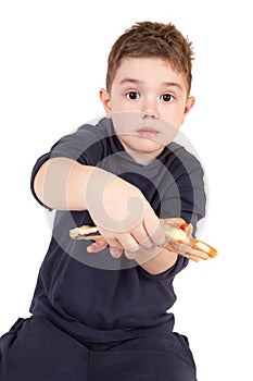 A young boy eating pizza