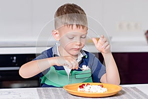 Young Boy Eating Plate of Cheese and Fruit