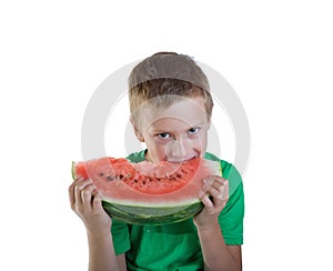 Young boy eating red melon