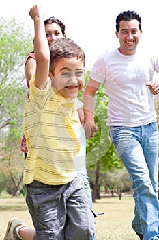 Young boy embrassing in the park with is family photo