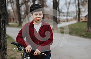 Young boy enjoying a bike ride in the park, embodying joy and activity