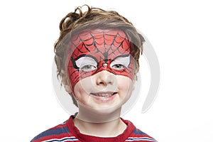 Young boy with face painting spiderman