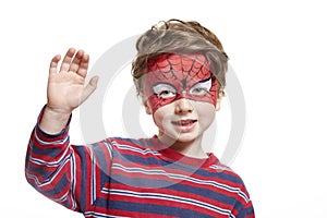 Young boy with face painting spiderman