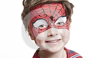 Young boy with face painting spiderman