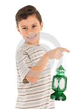 Young boy feeling happy with Ramadan lantern